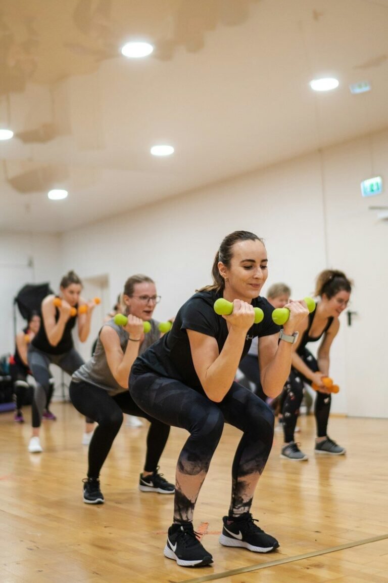 A group of women doing exercises with dumbbells