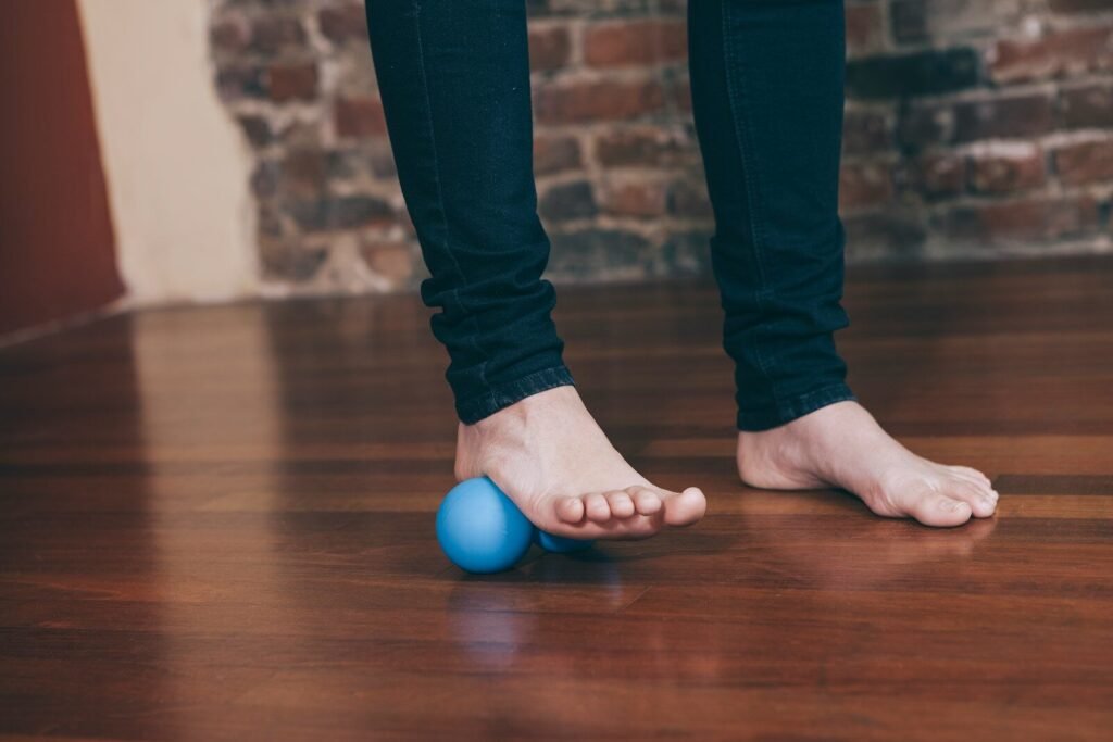 A person standing on top of a wooden floor