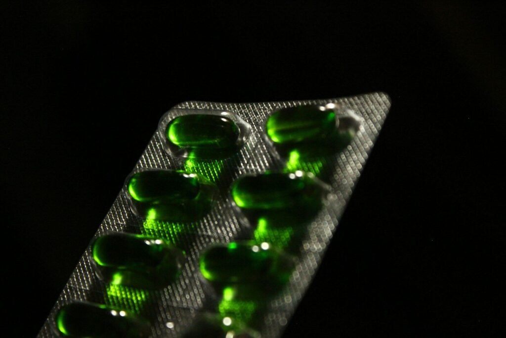 green medication pill in blister pack