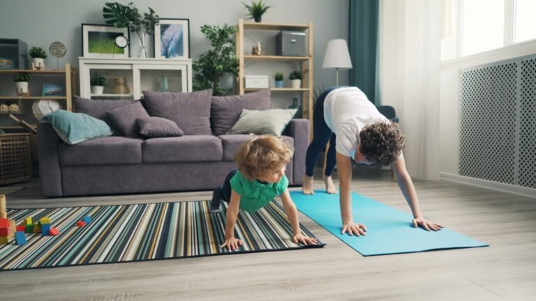 a woman and a child doing yoga in a living room