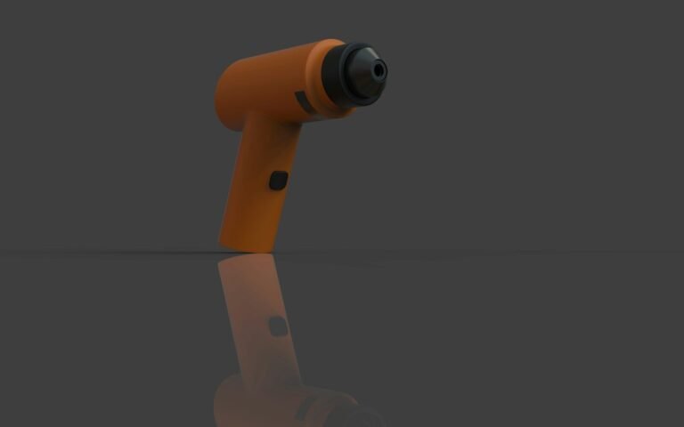 Orange cordless drill on a reflective surface